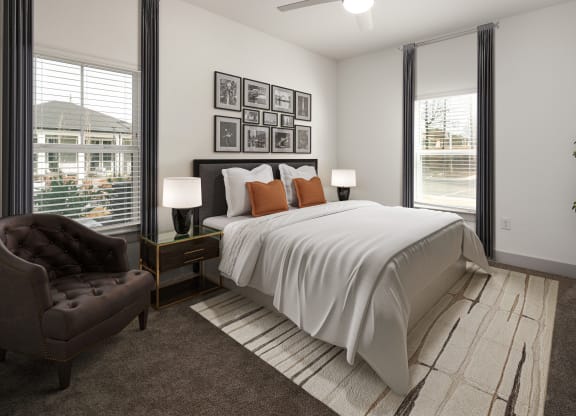 a bedroom with a bed and a chair