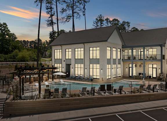 A modern house with a pool in the backyard.