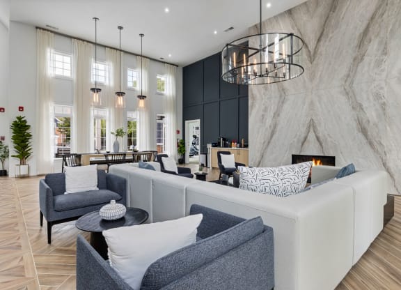 a living room with couches and chairs and a fireplace at Mariners Crossing, North Carolina, 27612