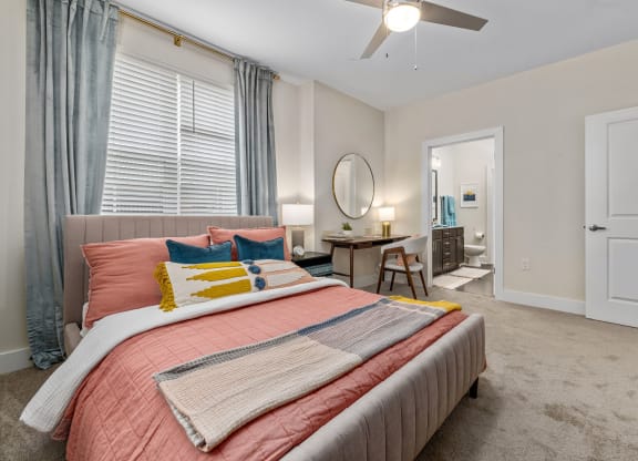 vertical shot of furnished model primary suite