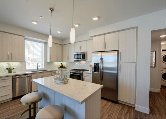Kitchen with Stainless Steel Appliances at Sola at Pacific Highlands Ranch Apartments, California, 92130