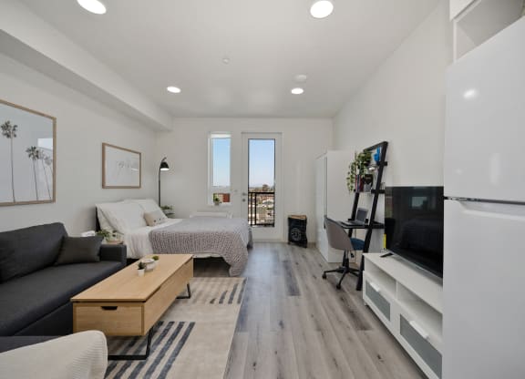 a living room with a couch and a bed