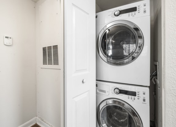a white washer and dryer in a laundry room