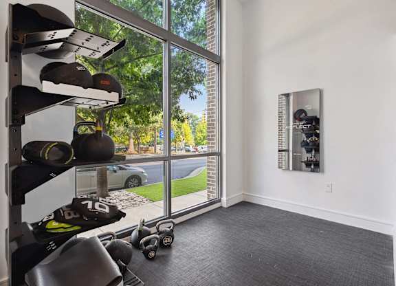 a room with a large window and white walls