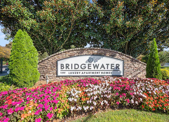 the sign for bridgewater at the entrance of the subdivision with flowers