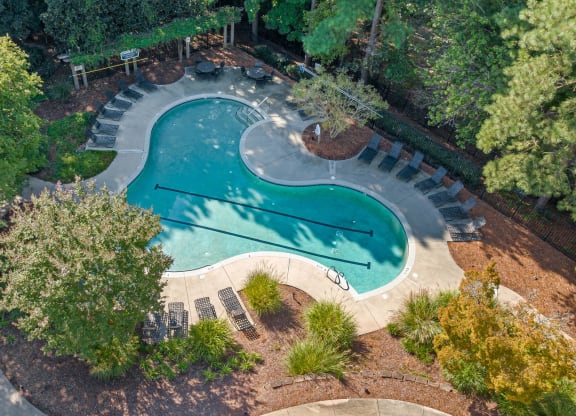 an aerial view of a swimming pool with trees and a courtyard at View at Lake Lynn, Raleigh, 27613