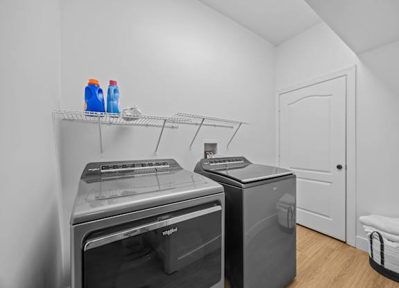 A laundry room with a washer and dryer.