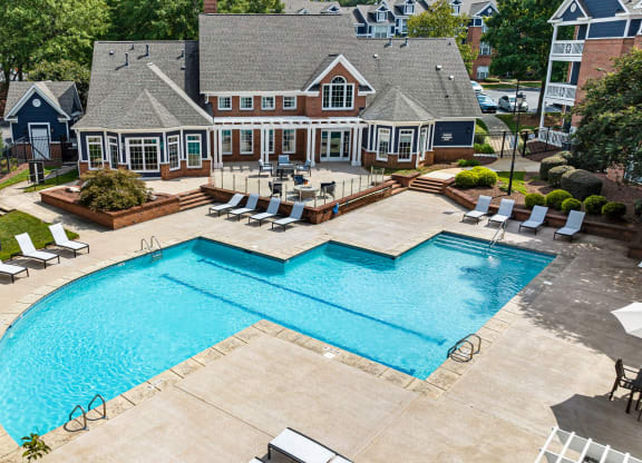 an aerial view of a swimming pool with a house in the background at Mariners Crossing, Raleigh, NC