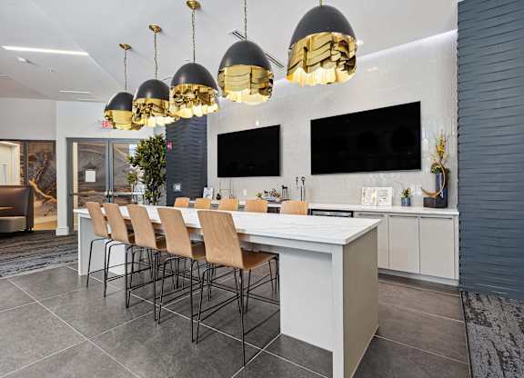 a room with a long table and chairs