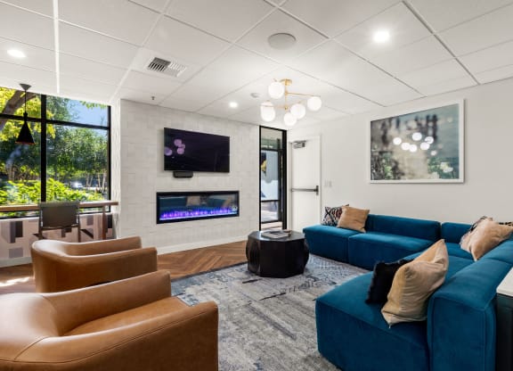 the preserve at ballantyne commons community living room with couches and a fireplace