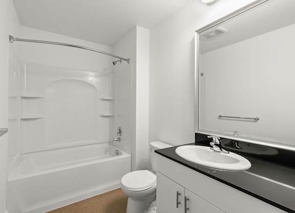 Bathroom with tub shower combo and vanity at Six Oaks Apartments, Bothell