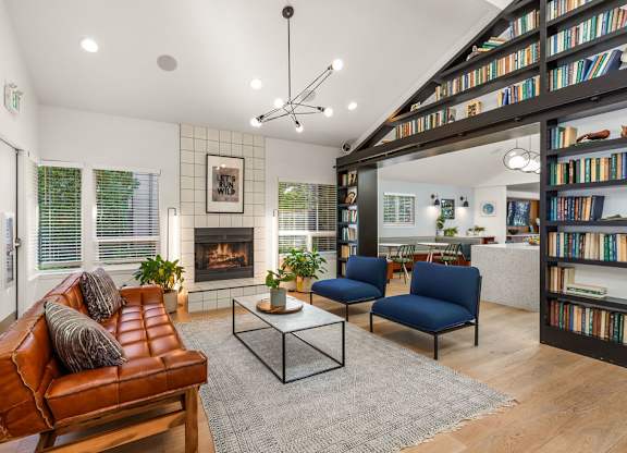Modern living room with fireplace and built in bookshelf at Scout Apartments, Kirkland, 98034