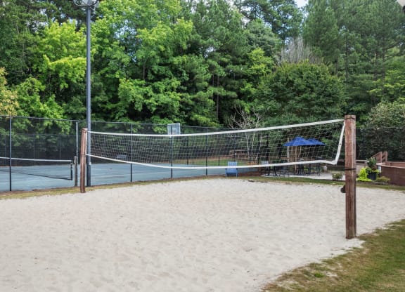 the sand volleyball court with the basketball/tennis court in the background