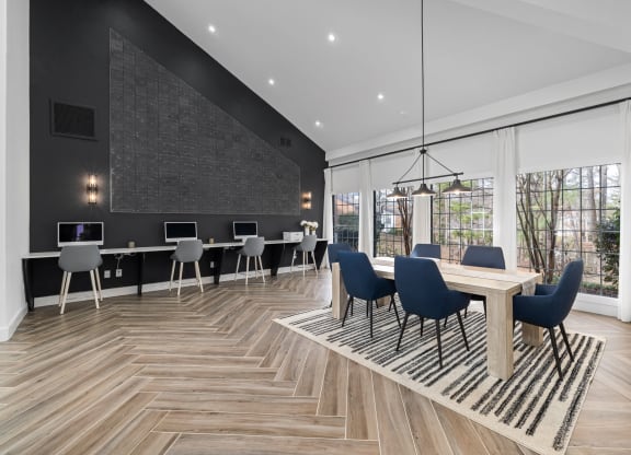a conference room with a table and chairs and a large window