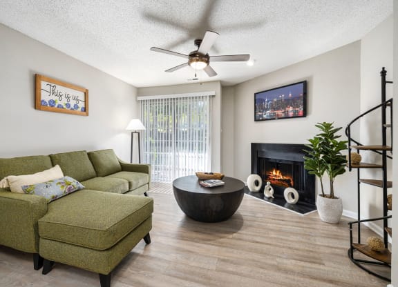 a living room with a couch and a chair and a fireplace at View at Lake Lynn, North Carolina