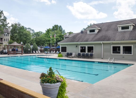 the swimming pool with a building in the background