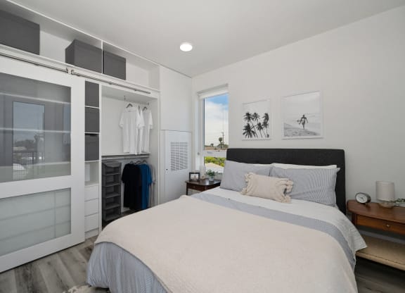 a bedroom with a large bed and a closet