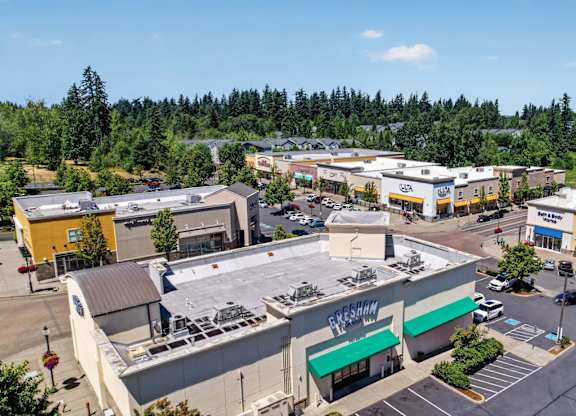 A view of a shopping center with a Greene's store in the foreground.