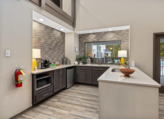 a kitchen with a large counter top and a window