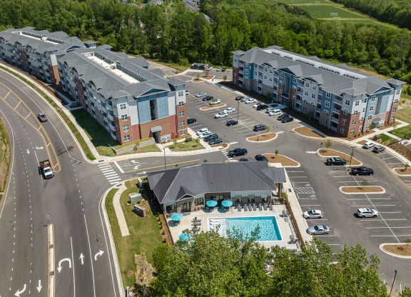 a building with a swimming pool in front of it