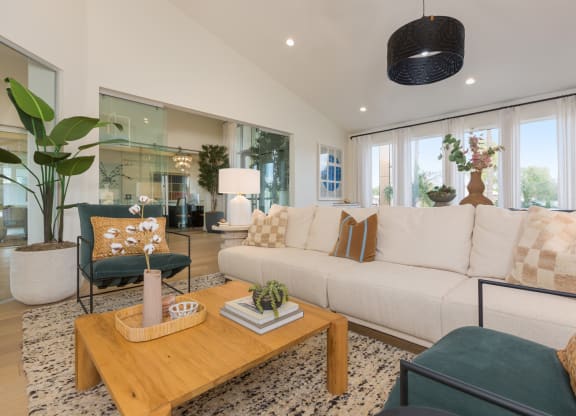 a living room with a white couch and a coffee table