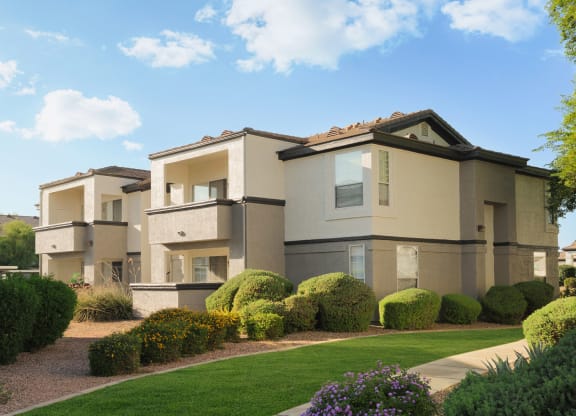 a render of a house in a yard with grass and bushes