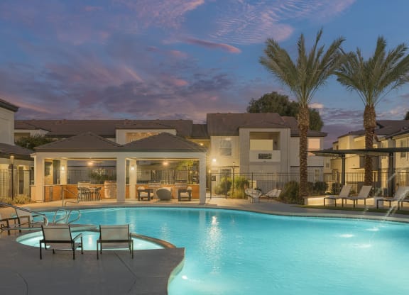 a swimming pool at night at the resort at governors crossing