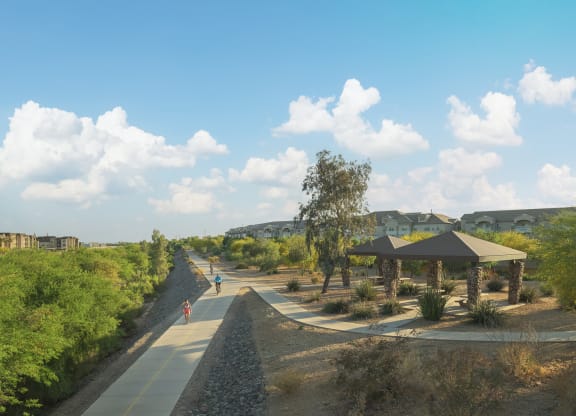 a rendering of a park with trees and people walking