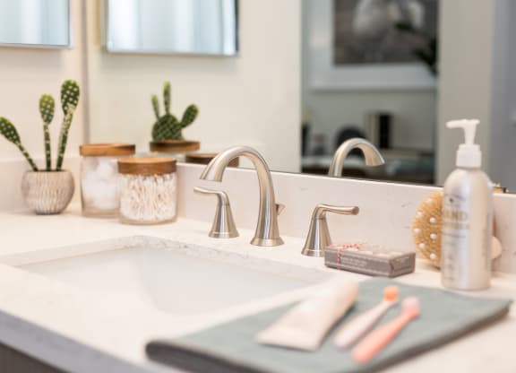 a bathroom with a sink and a mirror