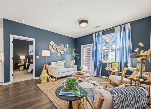 a living room with blue walls and a white couch