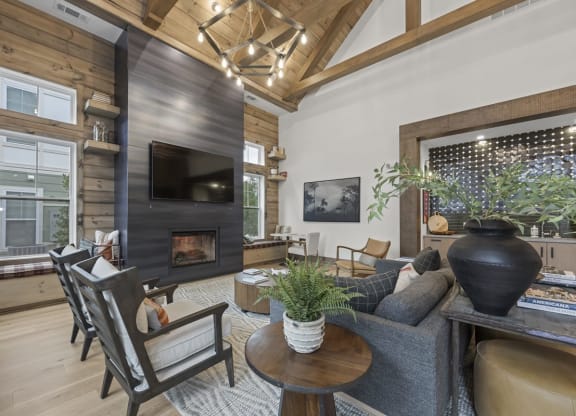 a living room with a fireplace and a tv