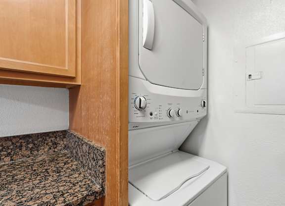 An in-unit stackable washer and dryer.