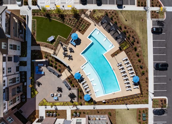 an overhead view of a swimming pool in a parking lot