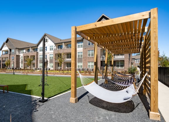 a hammock swing in front of an apartment building
