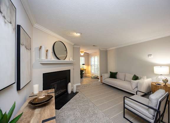 A living room with a fireplace and a couch.