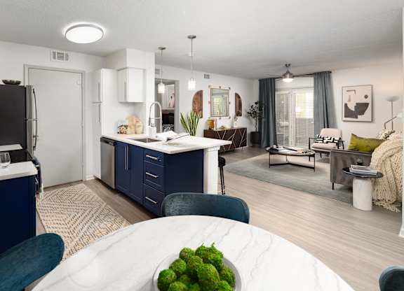 an open floor plan with a kitchen and living room