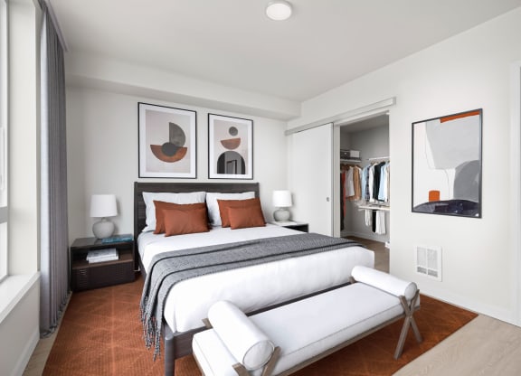 a bedroom with a bed and a chair in a room at Ion Town Center, Shoreline, WA