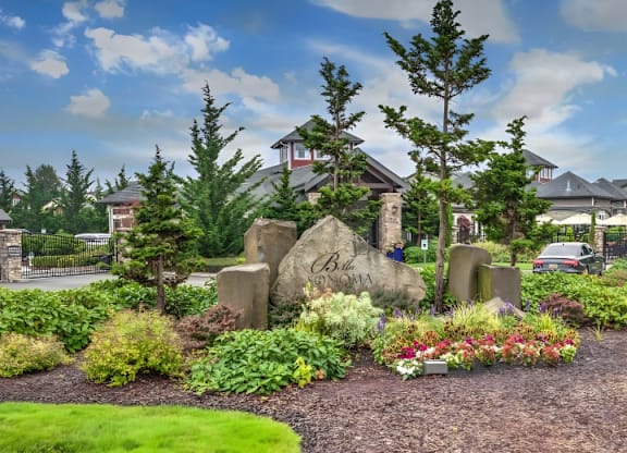 A garden with a sign that says