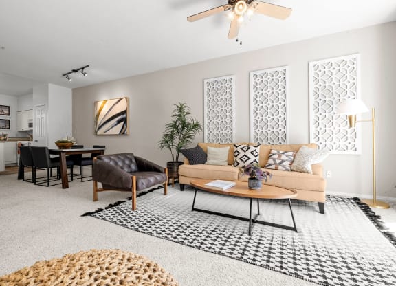 a living room with grey walls and white carpet