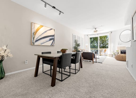 a dining room with a table and chairs