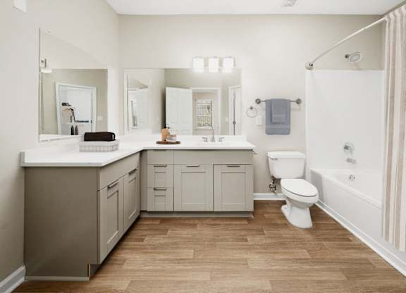a bathroom with a sink toilet and a shower