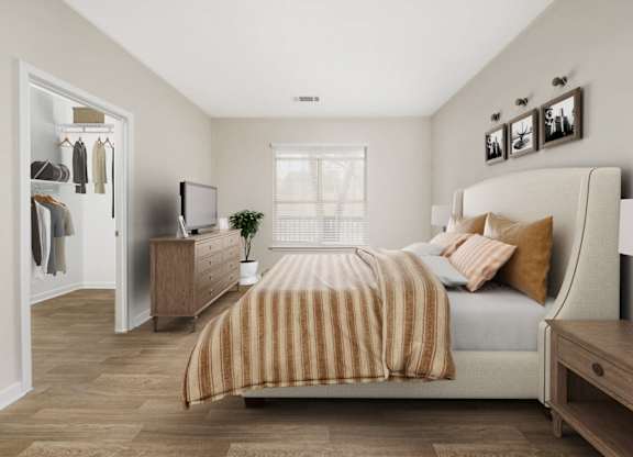 a bedroom with a bed and a dresser