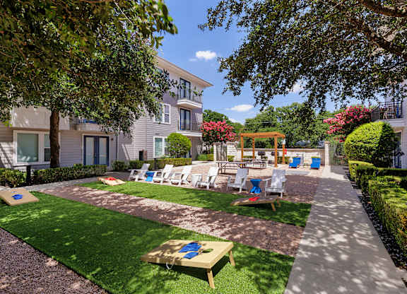 A sunny day at a residential area with a lawn and a playground.