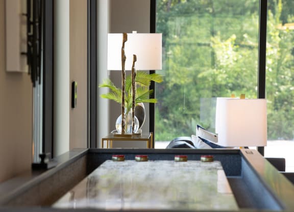 a living room with a table and a window