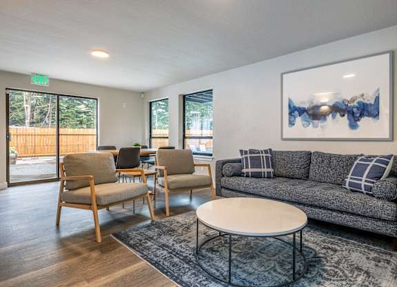 an open living room with a couch and a coffee table