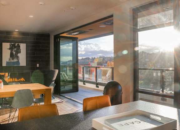 A modern dining room with a view of the mountains outside.at Axle, Washington, 98119