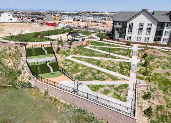 A park with a slide and a playground.