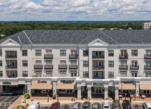 Exterior of apartment building with retail on first level.