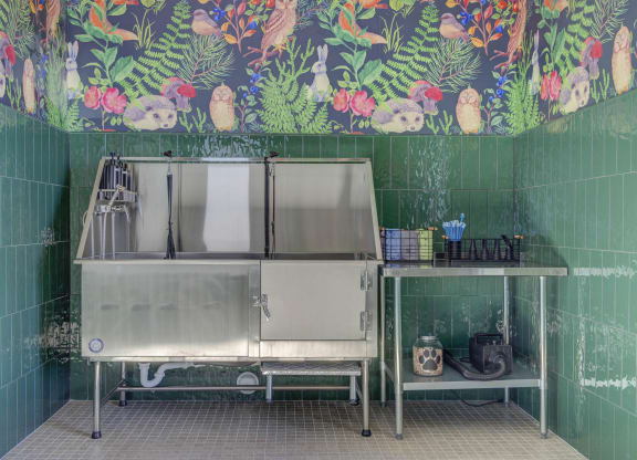a green tiled kitchen with a stainless steel sink and countertop  at Embold, Lehi, UT, 84043