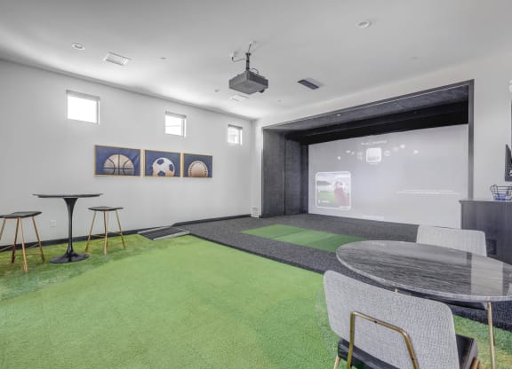 a room with a ping pong table and a projector screen  at Embold, Utah, 84043
